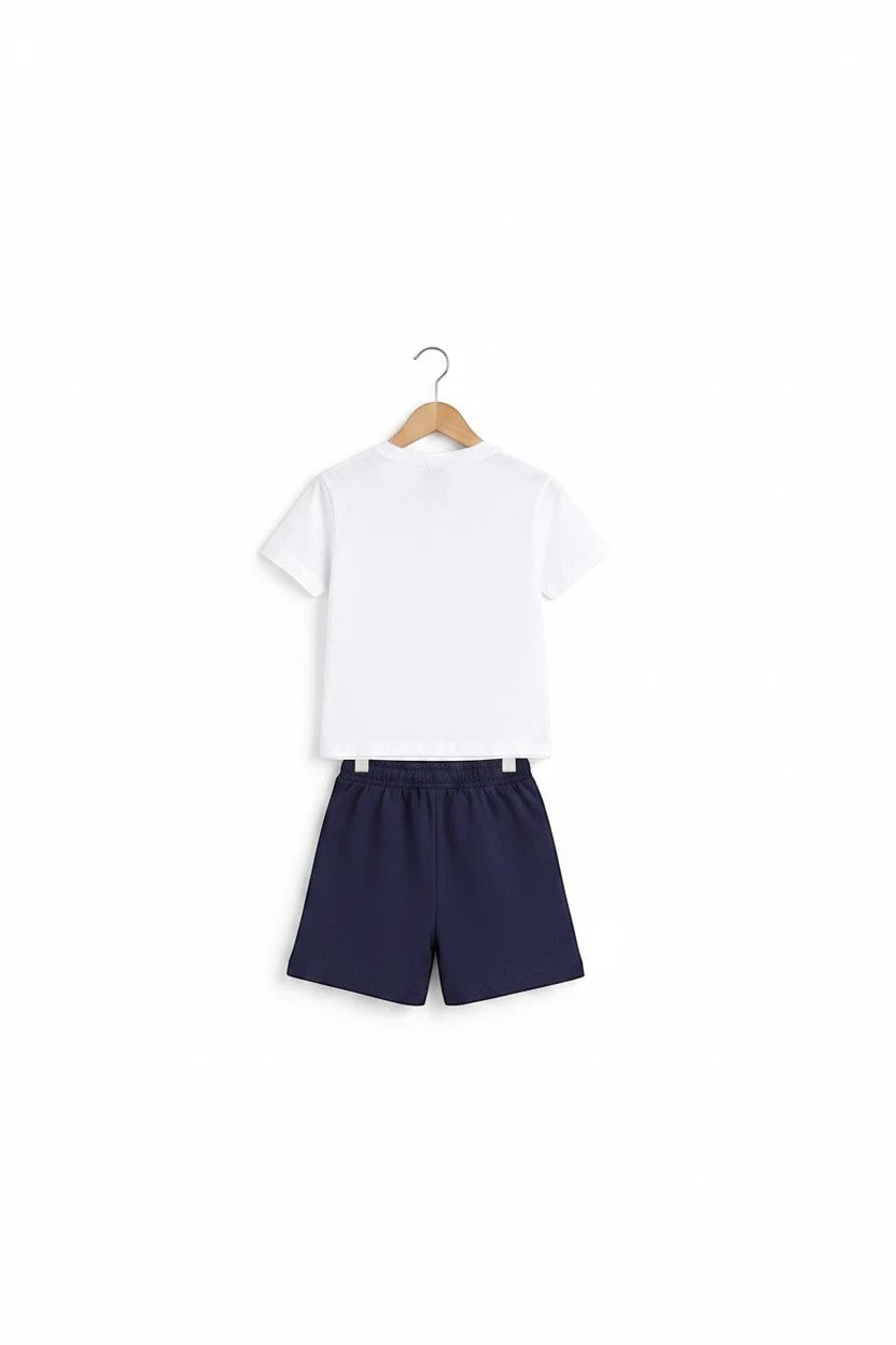 The Nile Luxuries boys white t-shirt and navy blue shorts set, back view of casual summer outfit on a hanger.