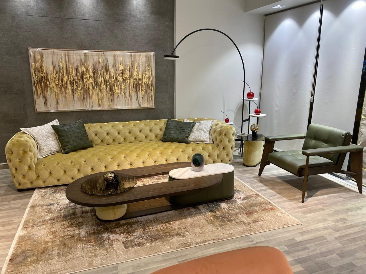 The Nile Luxuries tufted chartreuse velvet Chesterfield sofa with deep button-tufting and plush cushions.