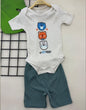 The Nile Luxuries baby boys ribbed knit short sleeve bodysuit with stacked bear graphic and shorts set in cream and teal.