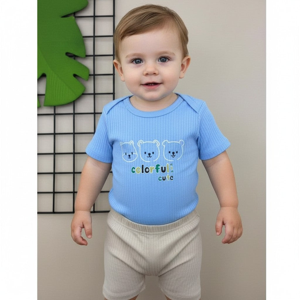 The Nile Luxuries blue ribbed knit baby bodysuit with bear print and beige ribbed shorts. Short sleeves, snap closure.