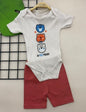 The Nile Luxuries baby bodysuit and shorts set in cream with bear print and red shorts. Ribbed knit fabric.