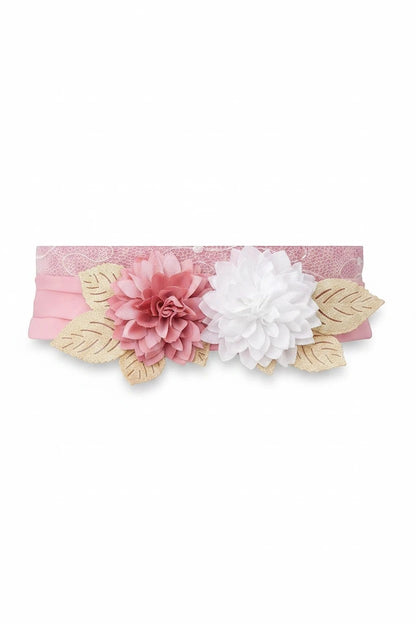 The Nile Luxuries baby girl's pink and white lace headband with floral appliqué and gold leaves.