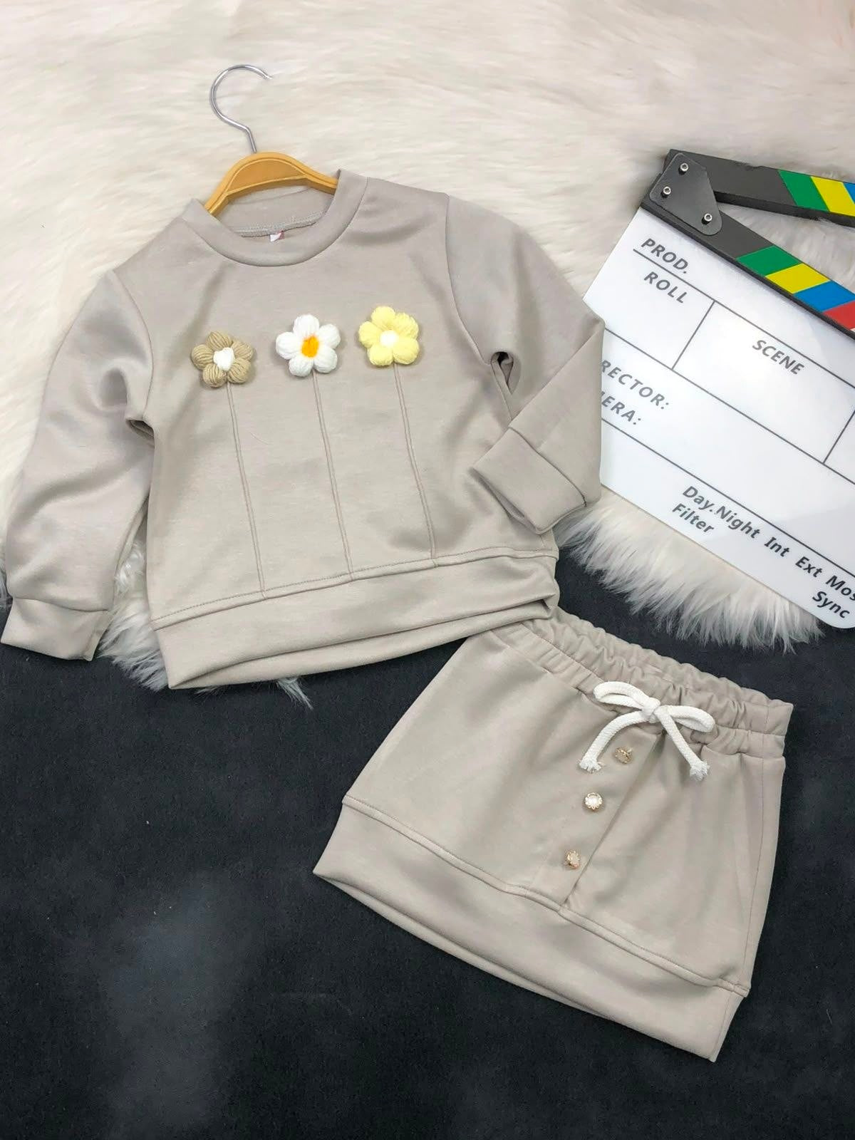 The Nile Luxuries girls beige sweatshirt and skirt set with textured floral appliques and drawstring waist detail