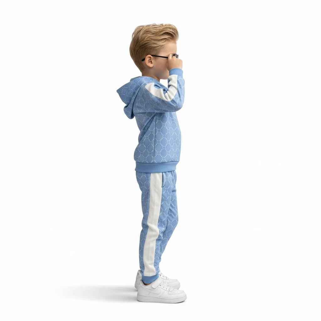 The Nile Luxuries light blue geometric print hoodie and jogger set with white side stripes worn by a young boy