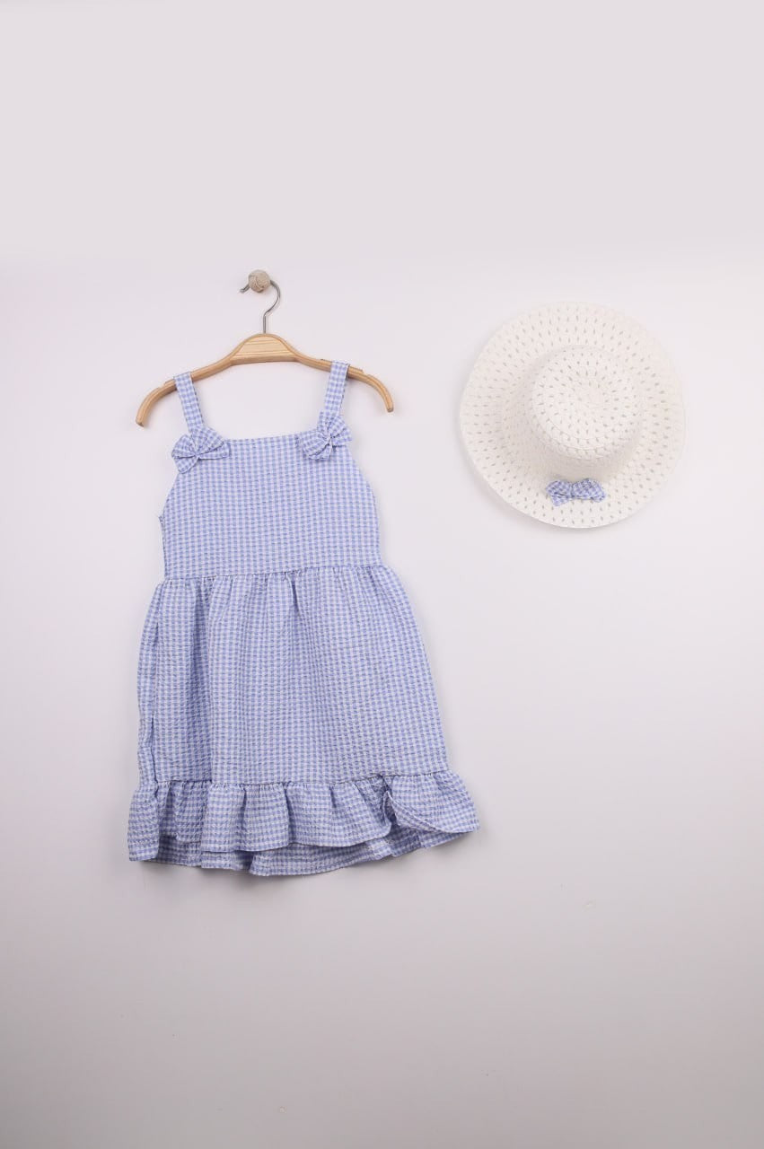 The Nile Luxuries blue gingham ruffle dress with bow straps and matching hat, perfect for summer.