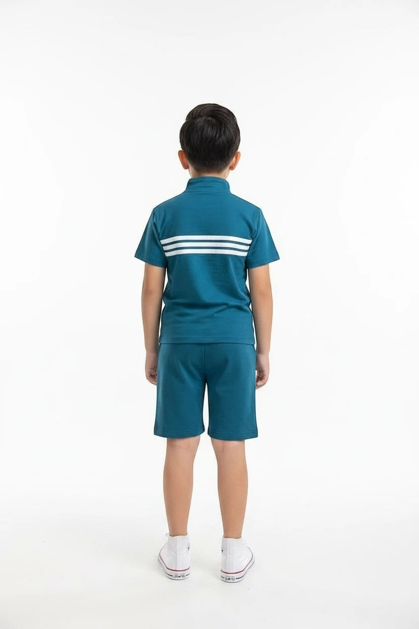 The Nile Luxuries boys teal athletic short set with quarter-zip top, triple-stripe detail, and matching shorts.