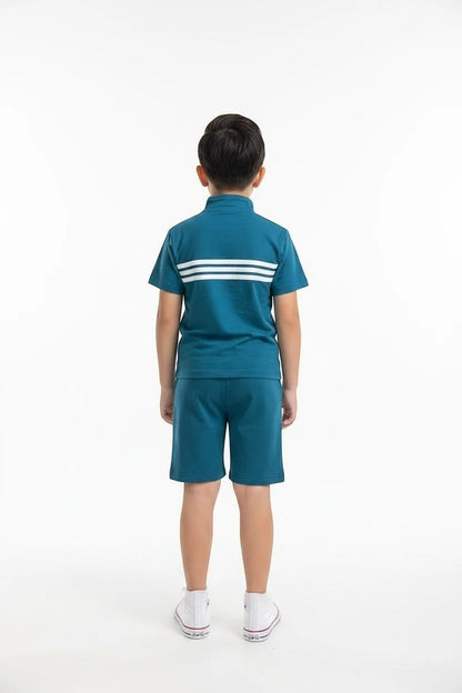 The Nile Luxuries boys teal athletic short set with quarter-zip top, triple-stripe detail, and matching shorts.