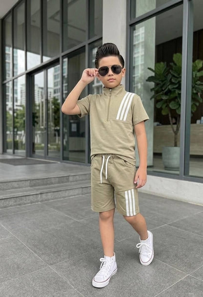 The Nile Luxuries boys athletic set with khaki quarter-zip shirt and matching shorts featuring white triple stripes.