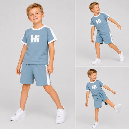 The Nile Luxuries blue short sleeve t-shirt and shorts set with white Hi graphic and side stripes on a young boy.