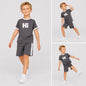 The Nile Luxuries grey and white short sleeve t-shirt and shorts set with Hi graphic on a young boy.
