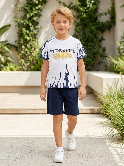 The Nile Luxuries boys summer outfit with white graphic t-shirt featuring flame prints and navy blue shorts.