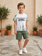 The Nile Luxuries boys summer outfit with a white graphic t-shirt featuring green flames and olive green shorts.