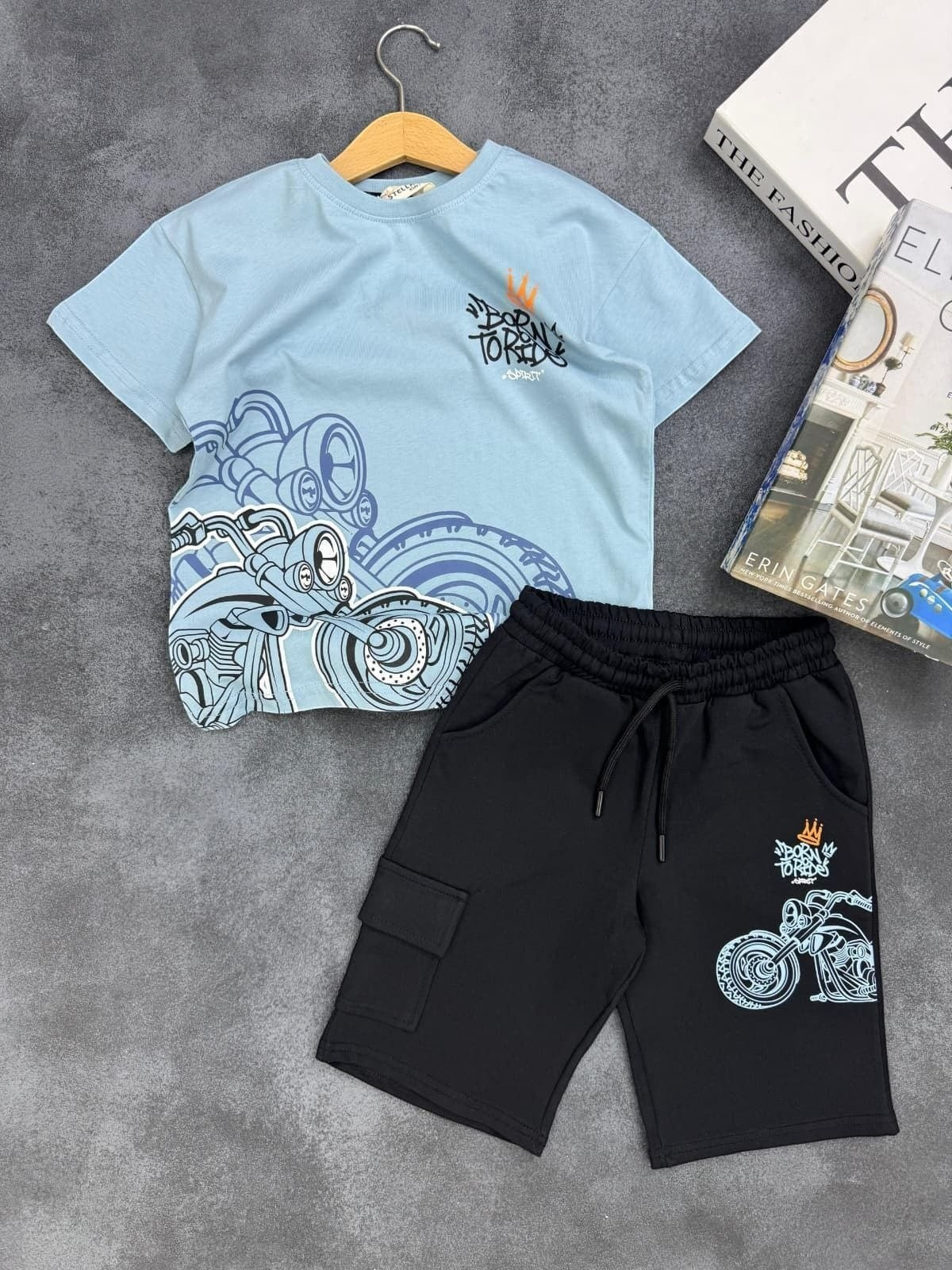 The Nile Luxuries boys' set with light blue Born to Ride motorcycle graphic tee and black cargo shorts with pockets.