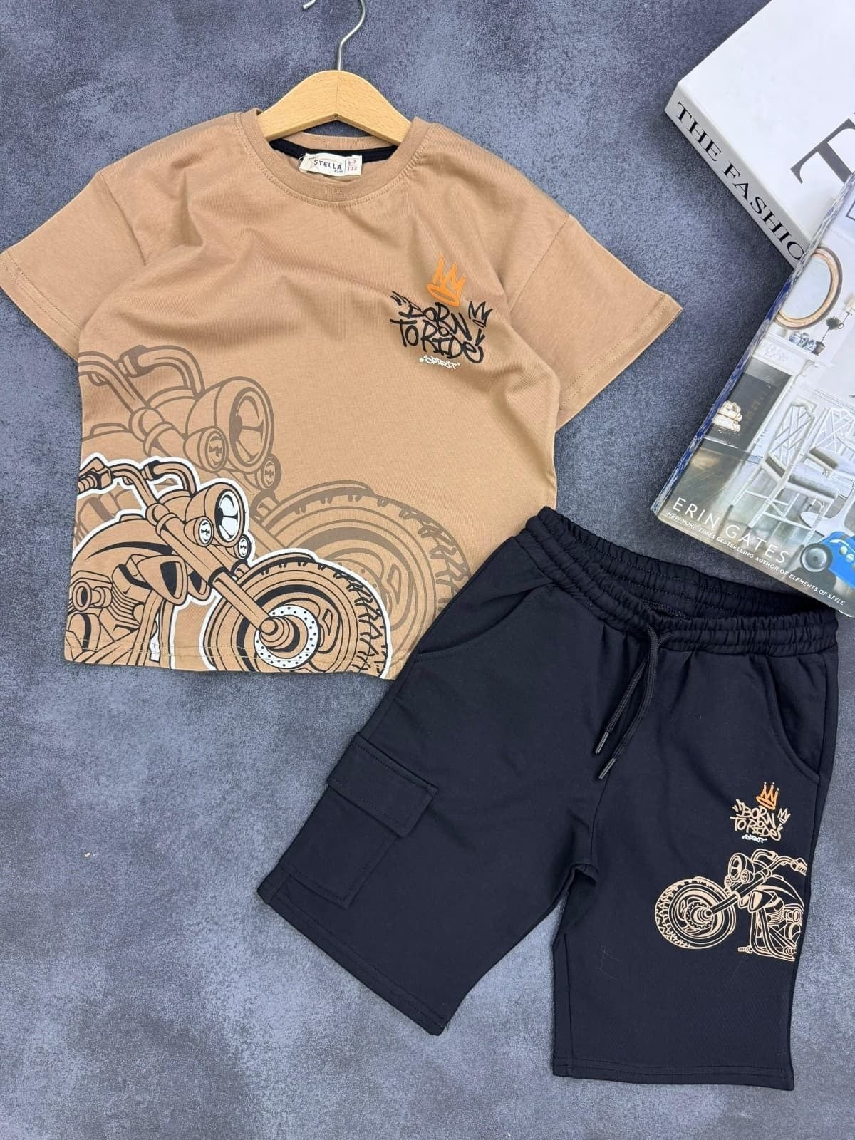 The Nile Luxuries boys' outfit with a tan motorcycle graphic t-shirt and black cargo shorts with drawstring waist.