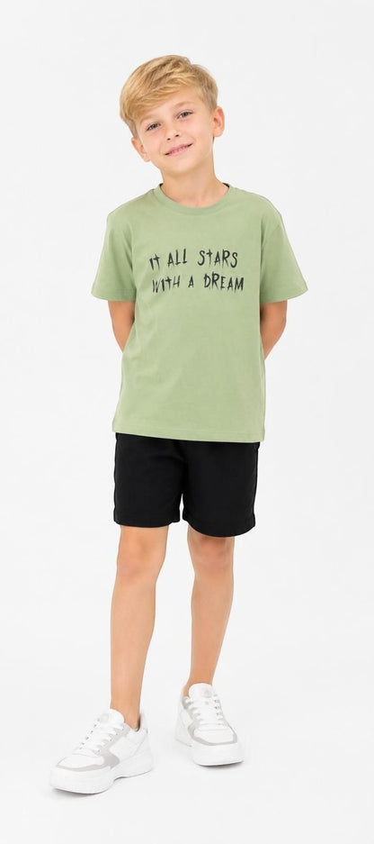 The Nile Luxuries sage green cotton t-shirt with It All Starts With A Dream graphic print on a young boy