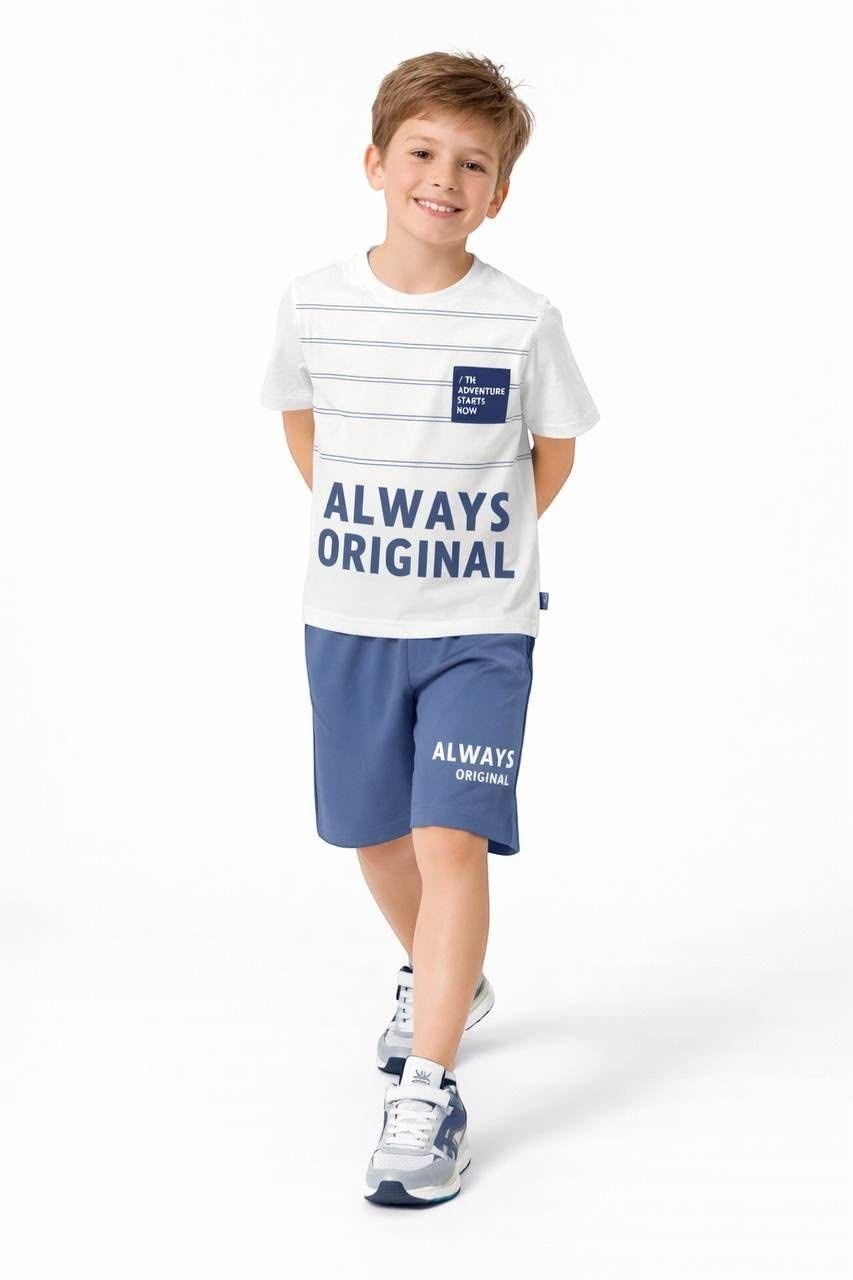 The Nile Luxuries boys' white striped graphic t-shirt and blue shorts set with Always Original print on a young boy.