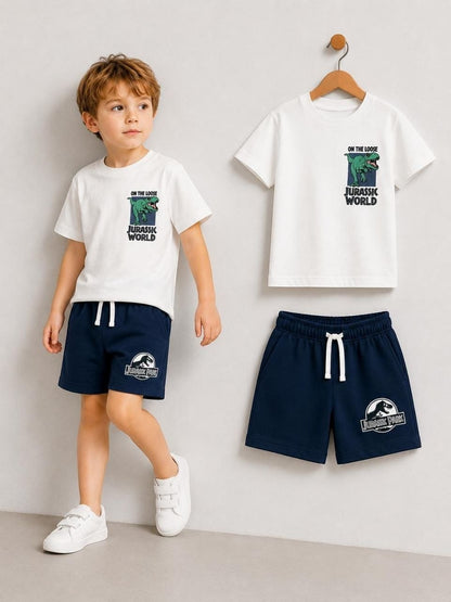 The Nile Luxuries boys' white Jurassic Park t-shirt and navy shorts set. T-shirt features dinosaur graphic. Shorts have drawstring waist.