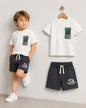 The Nile Luxuries boys' white Jurassic World t-shirt and charcoal shorts set. Features dinosaur graphic.