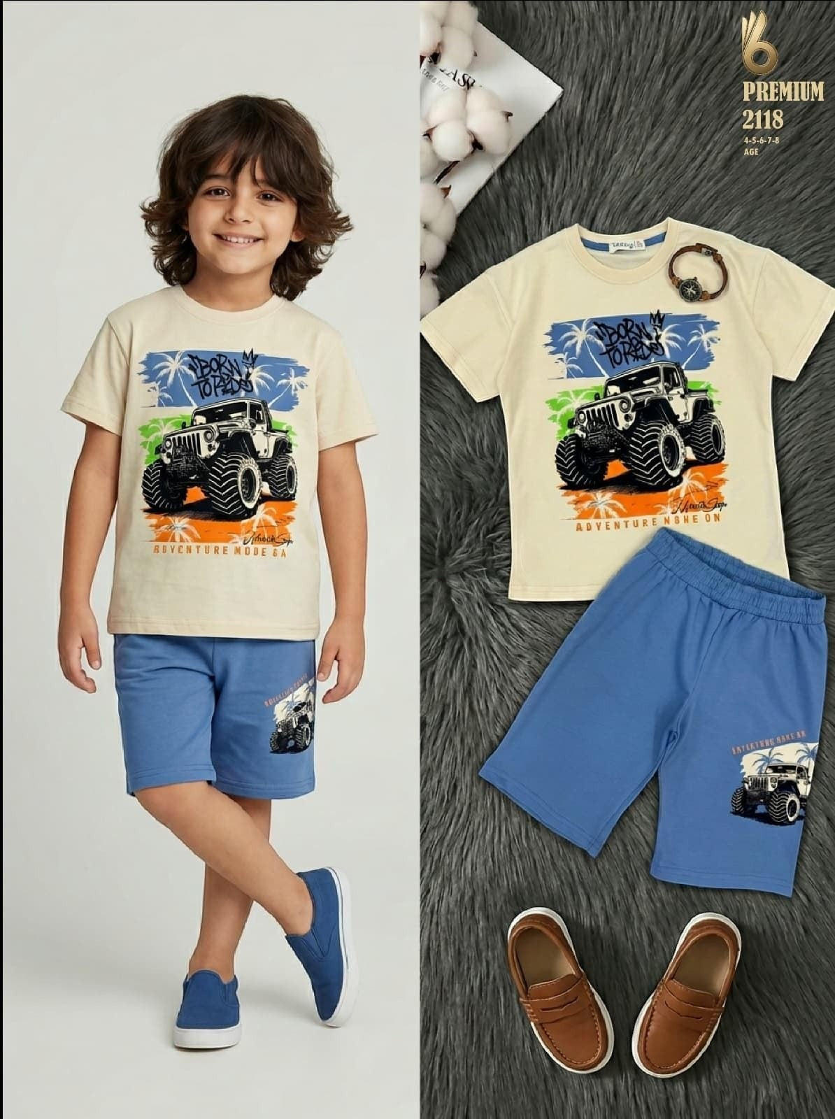 The Nile Luxuries boys cream t-shirt with monster truck graphic and blue shorts set worn by a young boy.