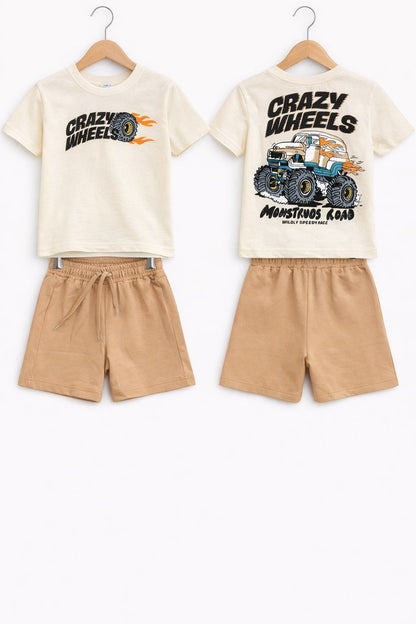The Nile Luxuries boys' cream t-shirt with monster truck graphic and tan drawstring shorts summer outfit set.