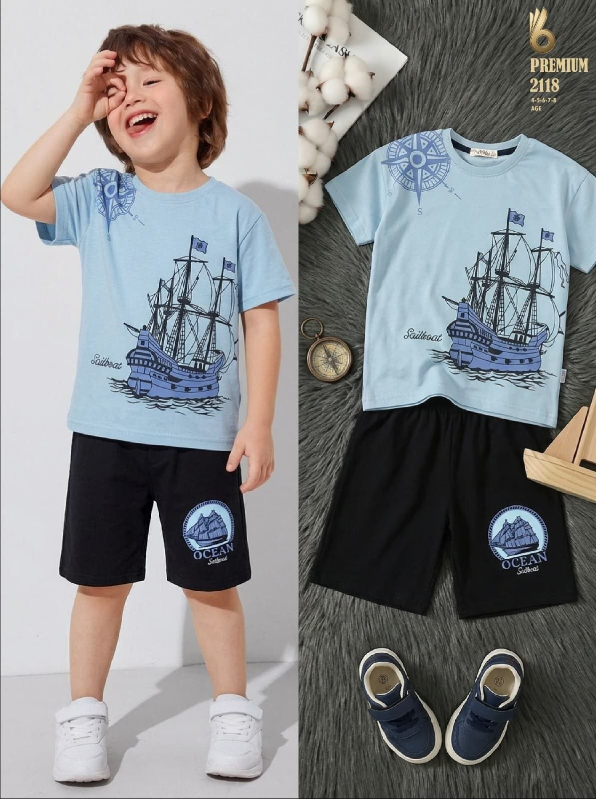 The Nile Luxuries boys nautical t-shirt and black shorts set with sailboat graphic and compass design.