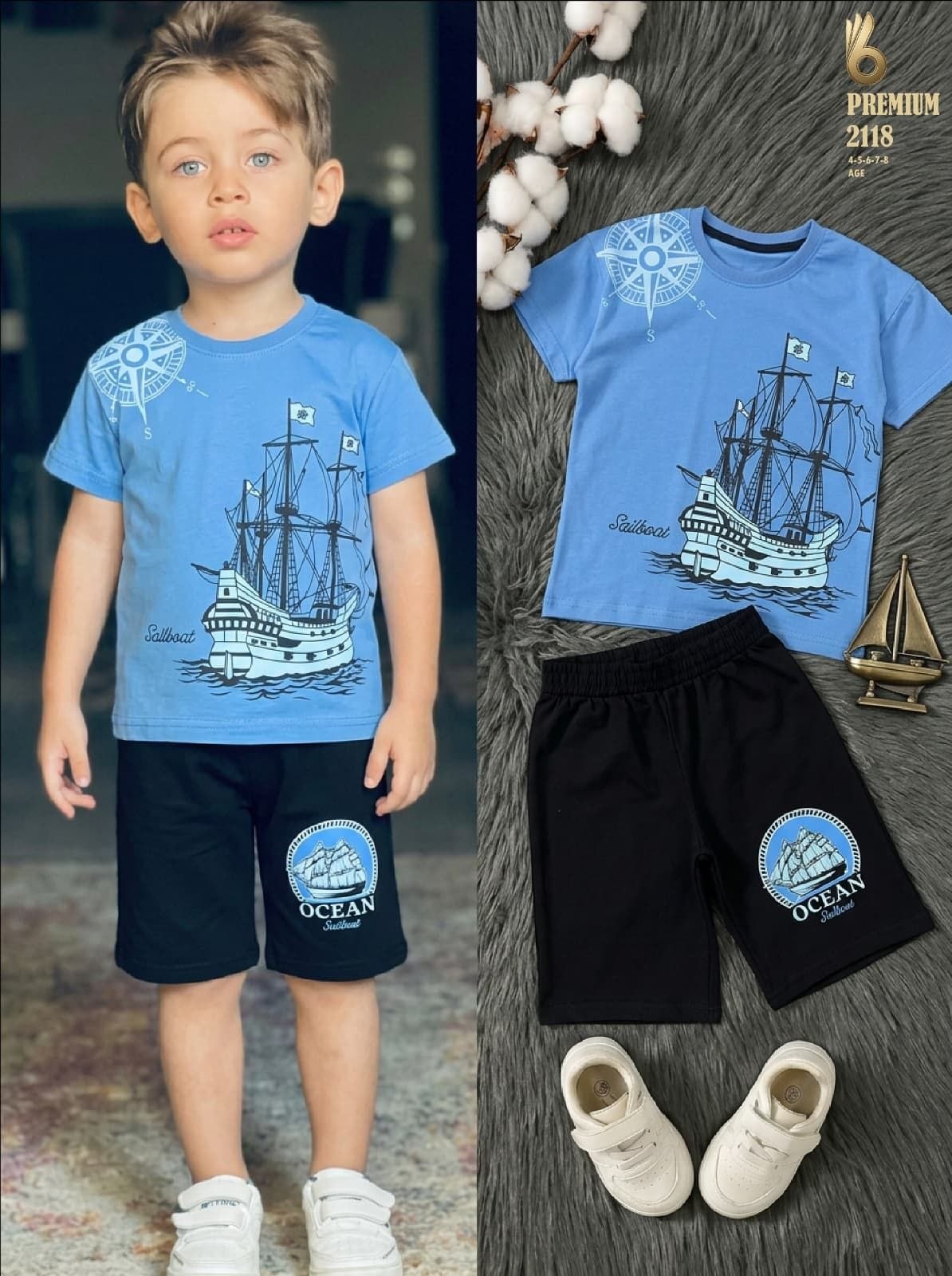 The Nile Luxuries boys nautical t-shirt and black shorts set with sailboat graphic and compass print on blue top.