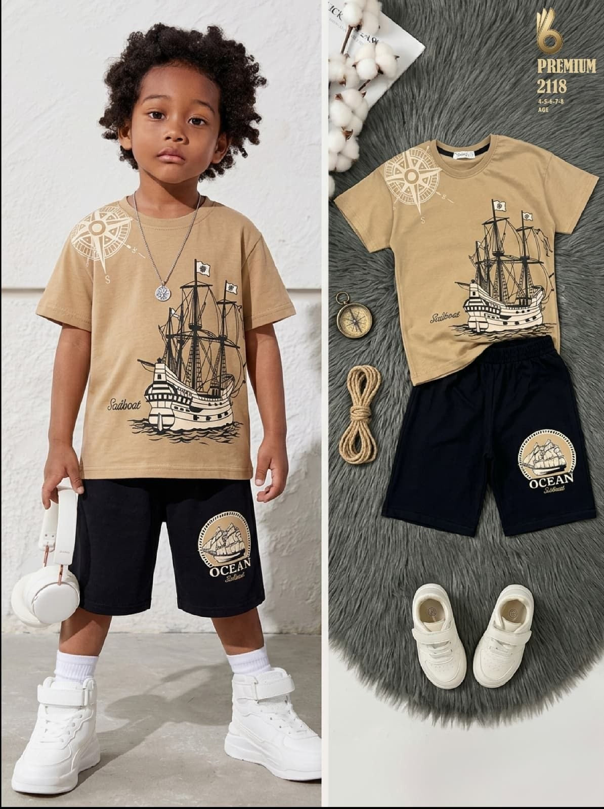 The Nile Luxuries boys nautical t-shirt and black shorts set with sailboat and compass graphic print.