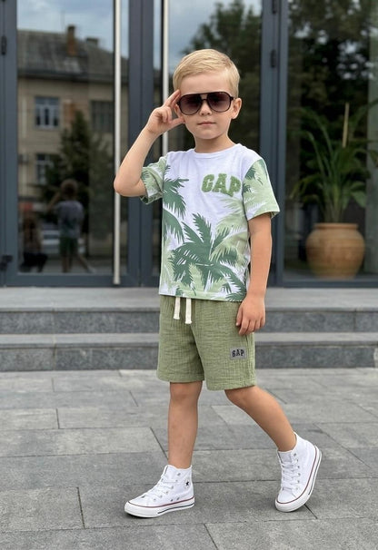 The Nile Luxuries boys' green palm print t-shirt and gauze shorts set with GAP logo. Elastic waist shorts.