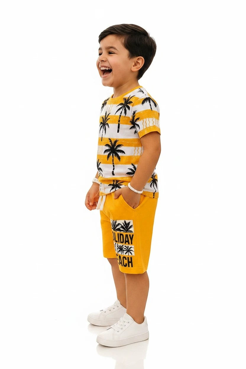 The Nile Luxuries boys' yellow palm tree print t-shirt and shorts set. T-shirt has white stripes. Shorts have "Holiday Beach" graphic.