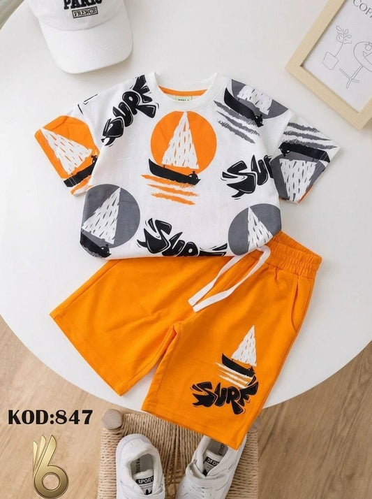 The Nile Luxuries boys' white cotton t-shirt and orange shorts set with sailboat and SURF graphic print.