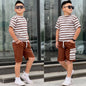 The Nile Luxuries boys summer outfit with brown striped t-shirt and matching cargo shorts on a young model.