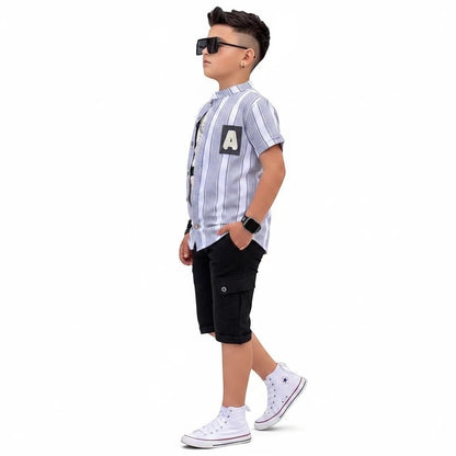 The Nile Luxuries boys summer outfit with a striped button-down shirt featuring an A-patch and black cargo shorts.