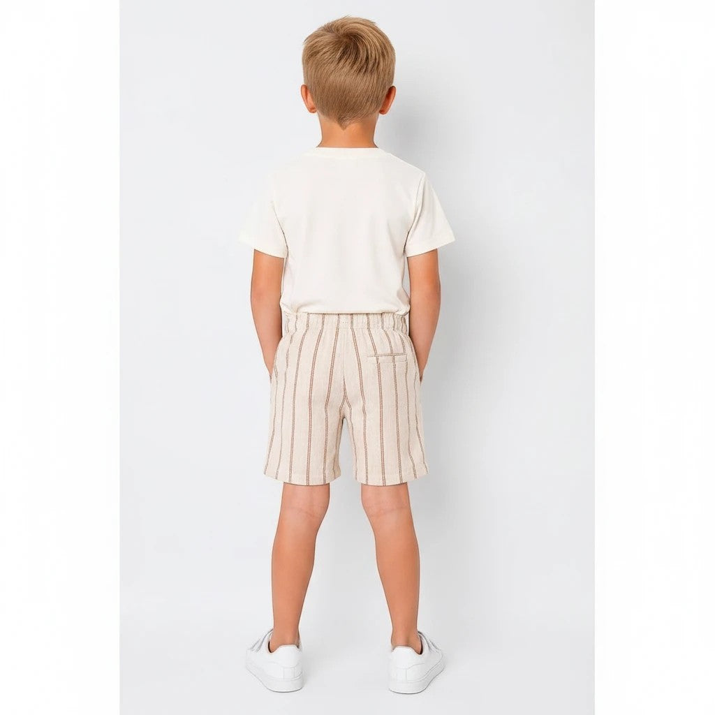 The Nile Luxuries boys set featuring a plain cream t-shirt and striped shorts with an elastic waistband, back view.