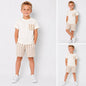 The Nile Luxuries boys cream crew-neck t-shirt with chest pocket and striped shorts set for summer casual wear.