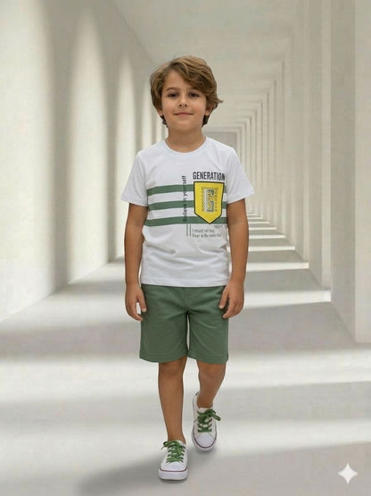 A young boy wearing a The Nile Luxuries white graphic t-shirt and green shorts in a bright, minimalist hallway.