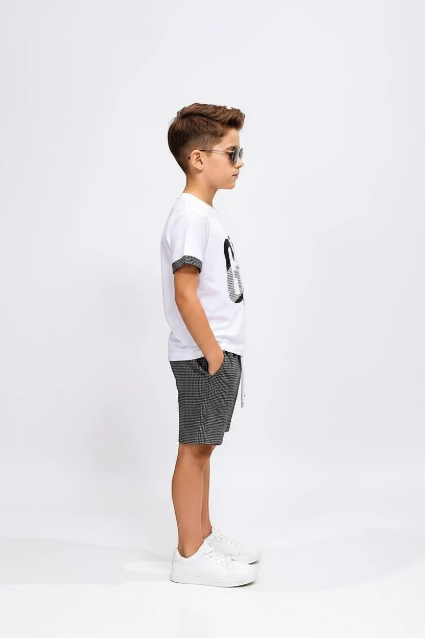 The Nile Luxuries boys white cotton t-shirt with GO graphic and checkered shorts outfit set on a young boy