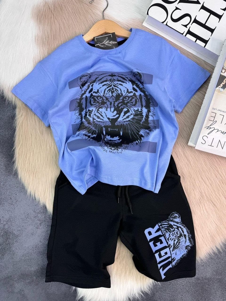 The Nile Luxuries boys blue t-shirt with tiger graphic and black shorts with tiger graphic. Cotton blend.