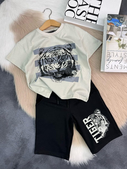 The Nile Luxuries boys light beige t-shirt with tiger graphic and black shorts with tiger print.