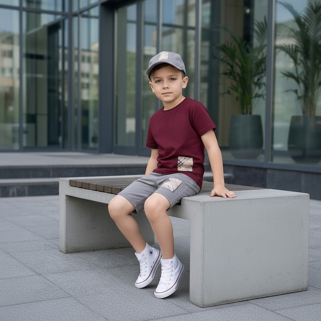 The Nile Luxuries burgundy cotton blend t-shirt and grey shorts set with checkered patch detail for boys.