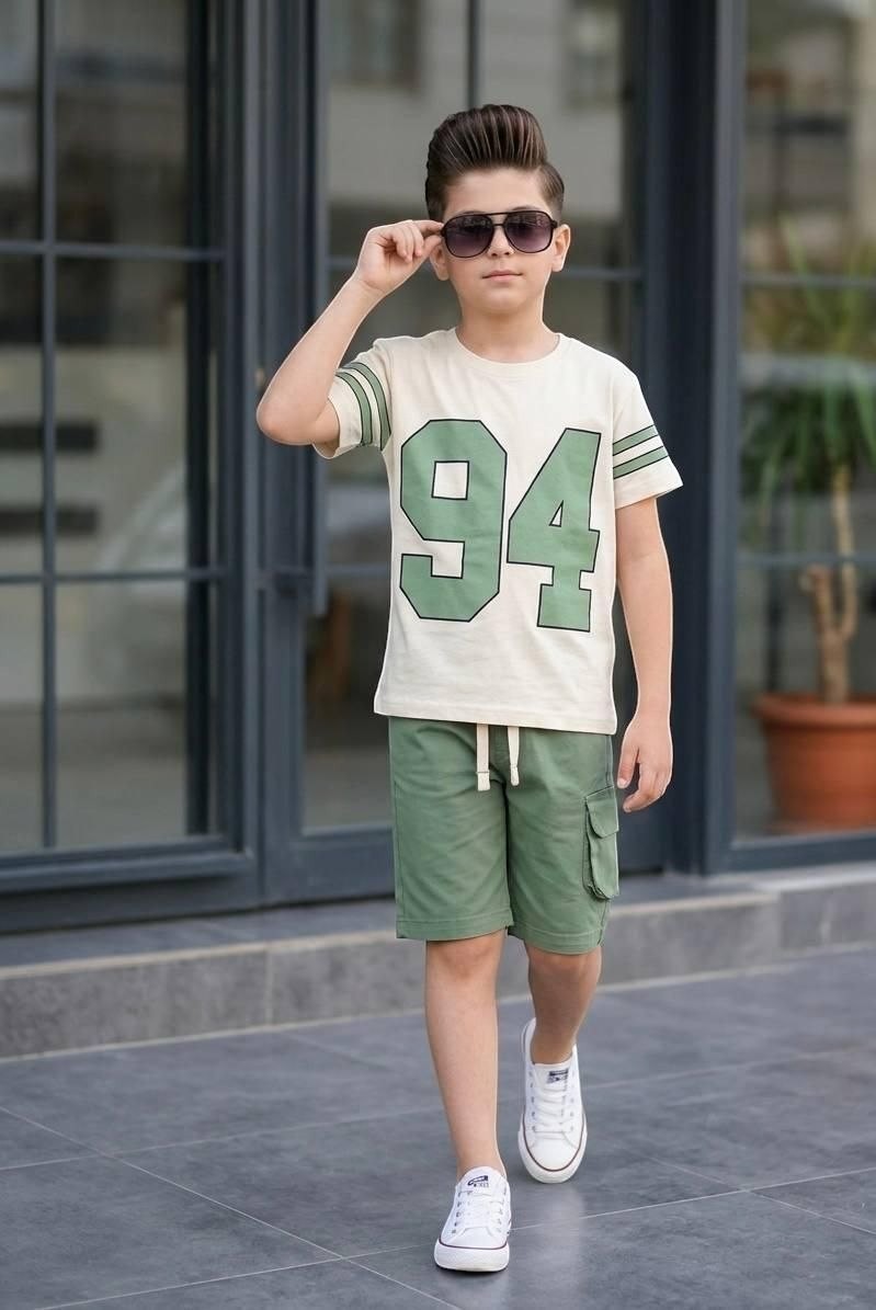 The Nile Luxuries boys' varsity t-shirt and cargo shorts set in cream and green with 94 graphic and striped sleeves.
