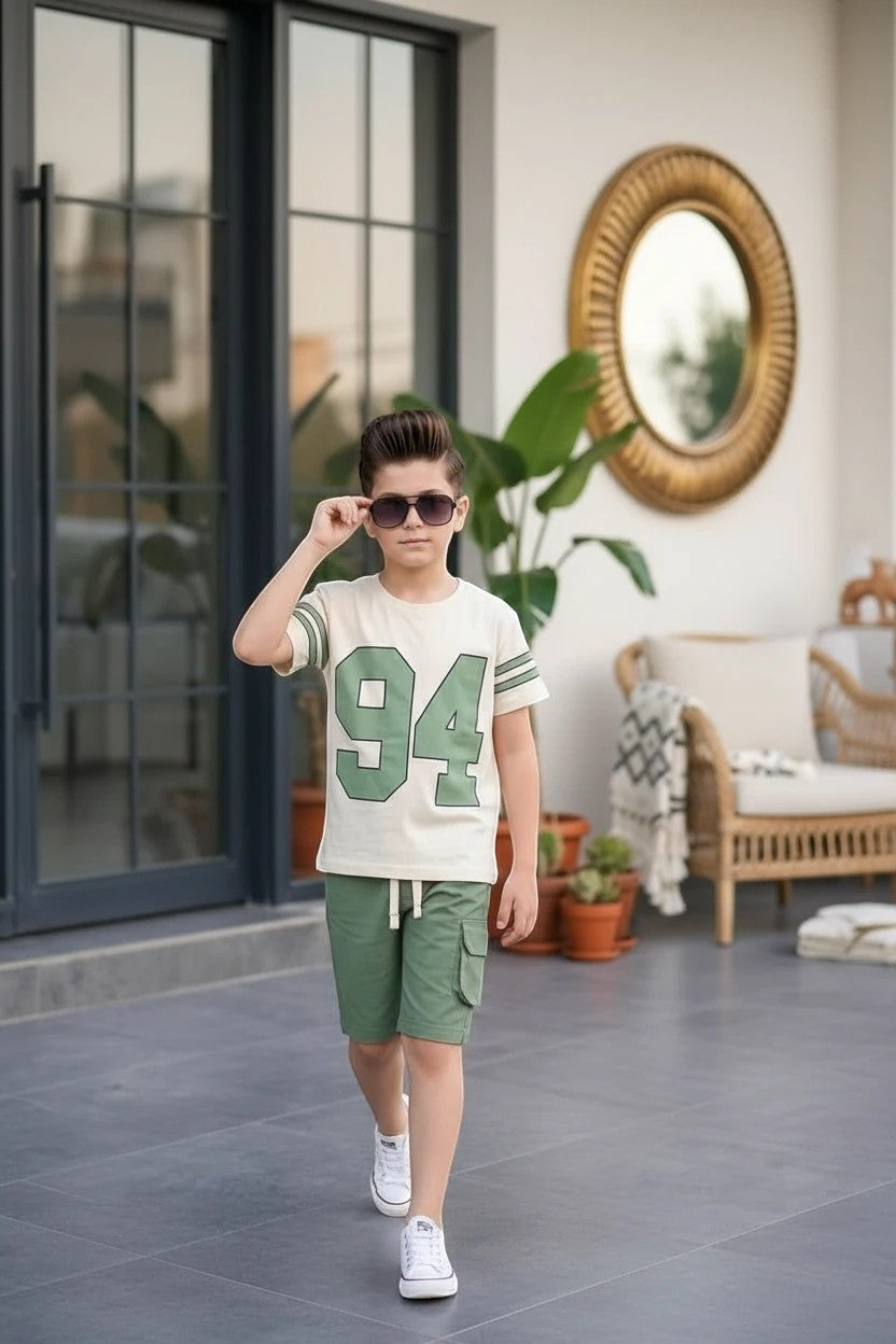 The Nile Luxuries boys varsity t-shirt and cargo shorts set in cream and green with 94 graphic print.