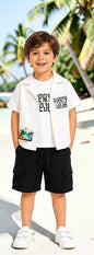 The Nile Luxuries boys white short sleeve camp shirt with tropical graphic and black cargo shorts.