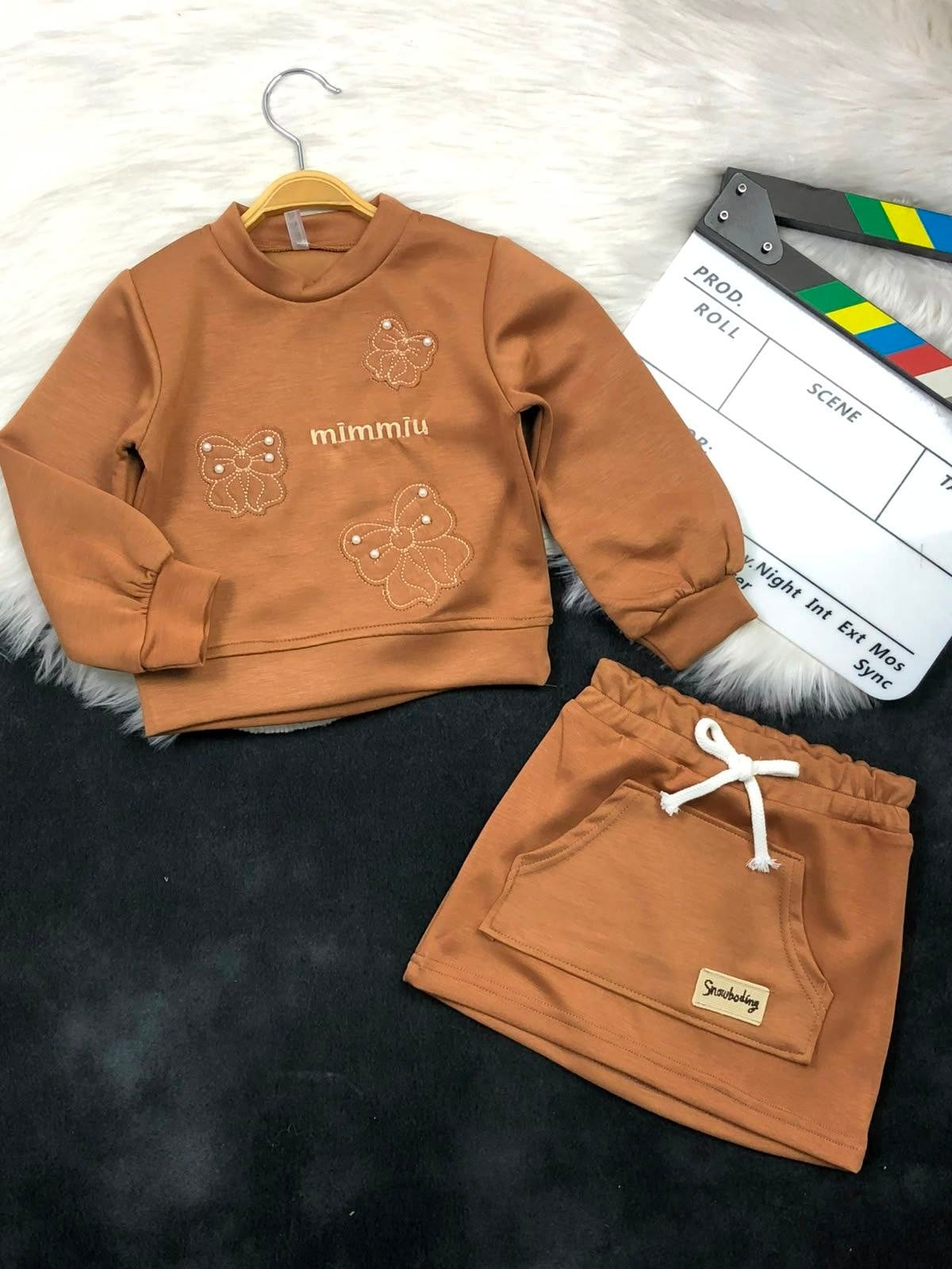 The Nile Luxuries girls brown long sleeve sweatshirt with butterfly embroidery and matching skirt with front pocket