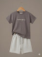 The Nile Luxuries children's charcoal t-shirt with Freedom made On! graphic and light grey drawstring shorts set.