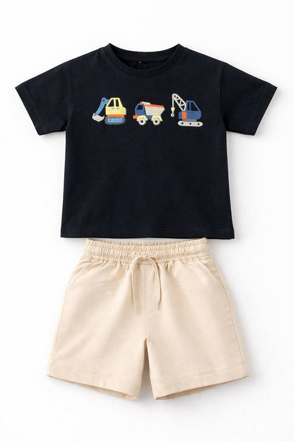 The Nile Luxuries children's black short-sleeve t-shirt with construction vehicle embroidery and beige drawstring shorts.