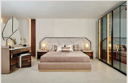 The Nile Luxuries contemporary bedroom set with dark wood, gold accents, white marble-effect vanity, upholstered stool, and abstract mirror.
