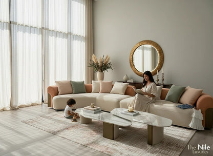 The Nile Luxuries contemporary cream sectional sofa with peach accents and plush cushions. Includes throw pillows.