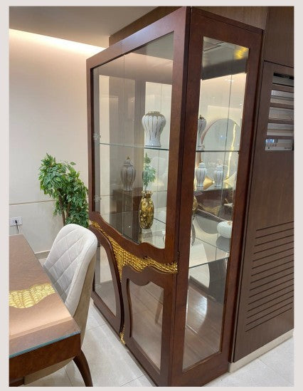 The Nile Luxuries dark wood dining buffet and hutch with gold inlay and LED lighting. Features glass doors and shelves.