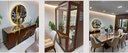 The Nile Luxuries dark wood dining set with gold inlay, glass top buffet, and illuminated hutch.