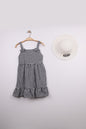 The Nile Luxuries black and white gingham ruffle dress with bow straps and matching hat. Lightweight fabric, perfect for summer.